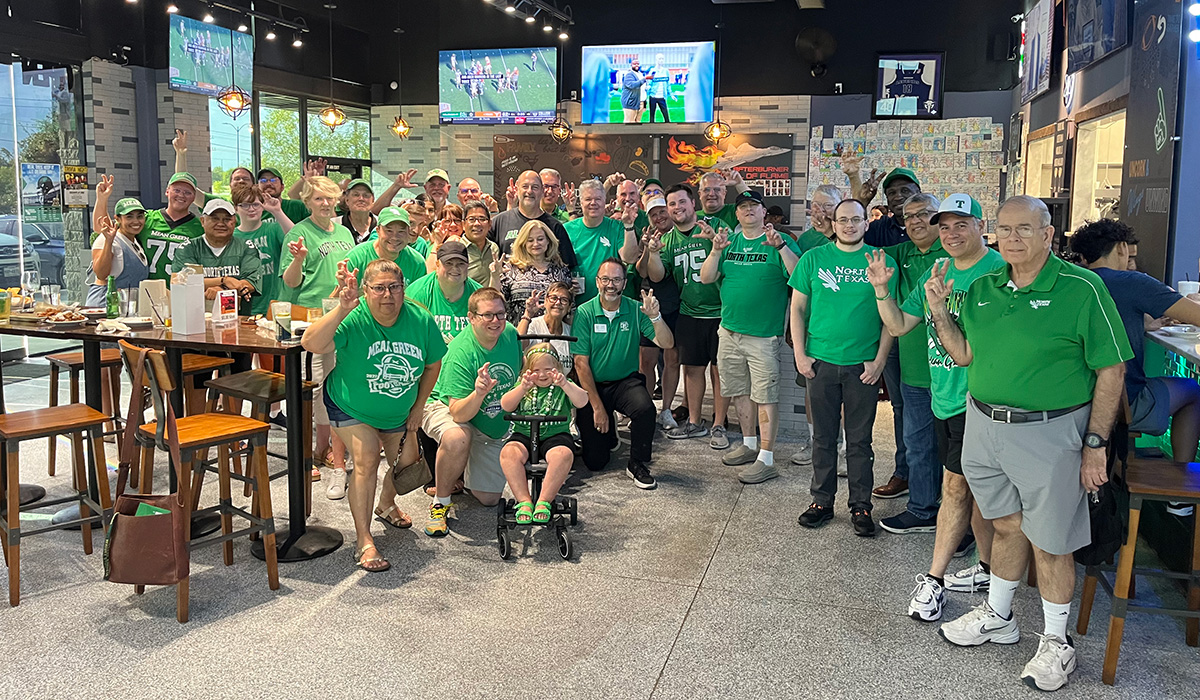 Alumni at a Collin County football watch party