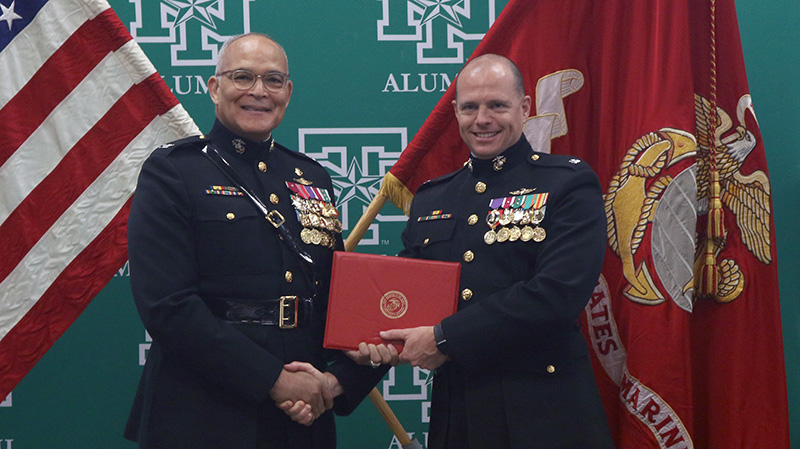 Daniel Robnett poses with retired Col. William Dwiggins, who performed the pinning at Daniel's promotion ceremony.