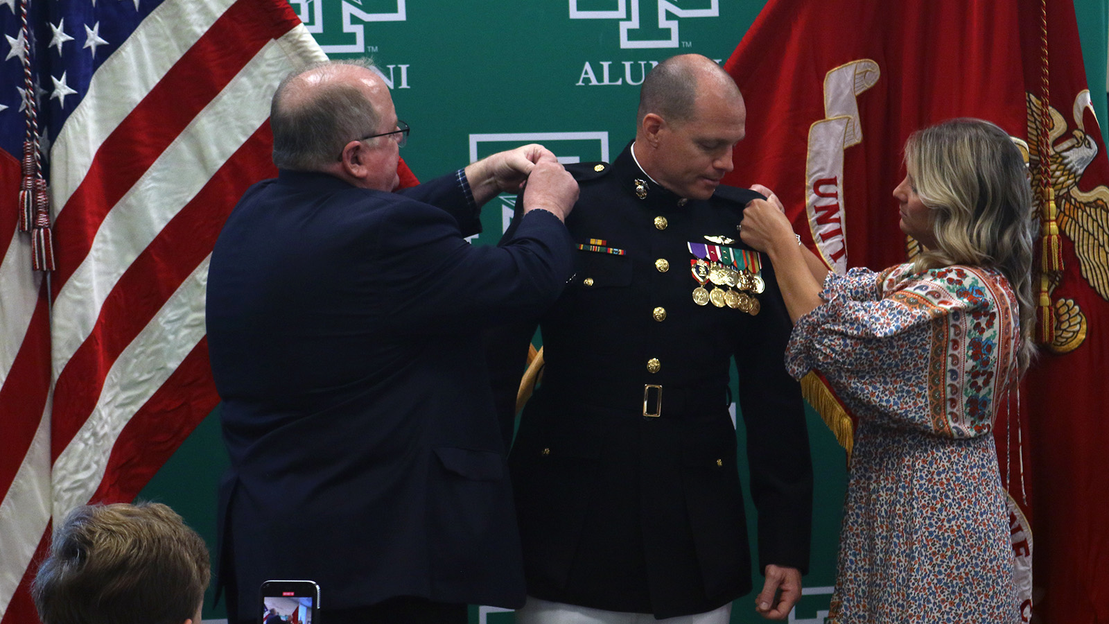 Mike Robnett, Daniel Robnett and his wife Stephanie at Daniel's pinning ceremony in 2022.