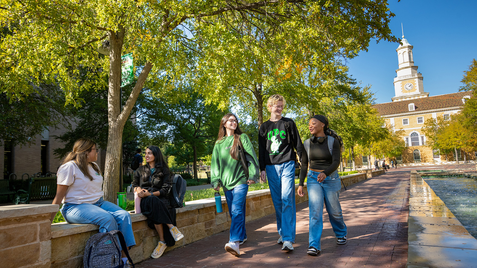 Students walking down the Library Mall on a fall day.